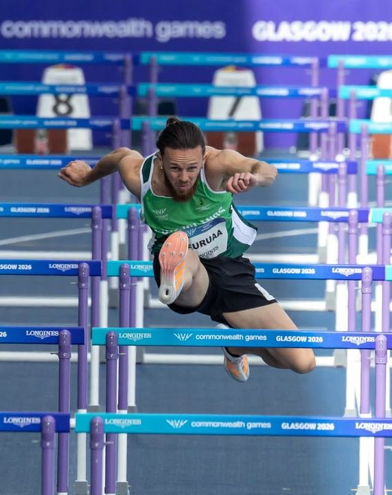 Clearing a hurdle at the Commonwealth Games
