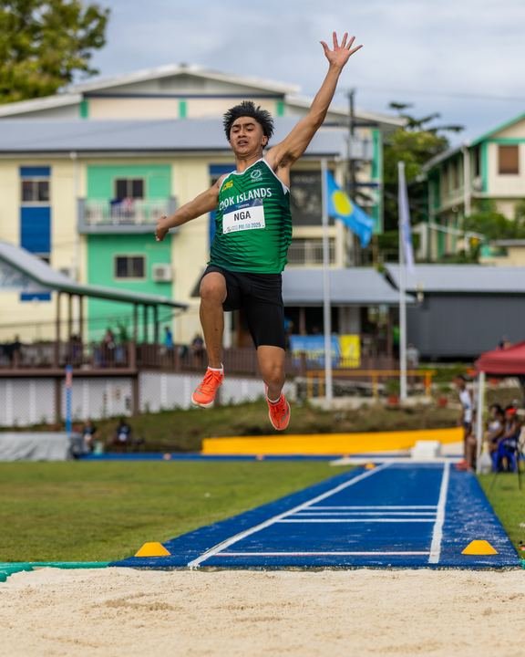 Long jump take-off, arms reaching high