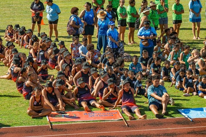 Schools gather on the infield with their teams.