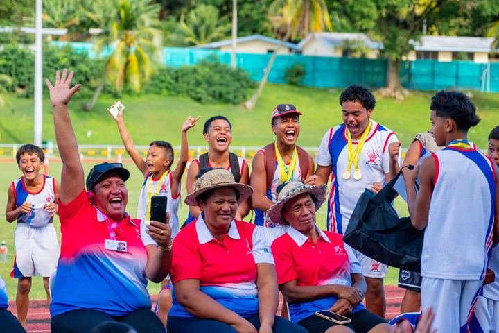 Medal winners and supporters celebrate at the National Stadium