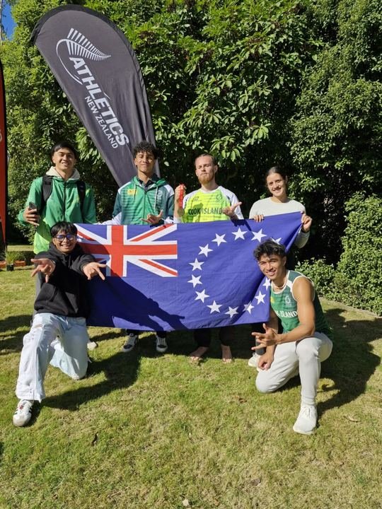 Cook Islands athletes with the flag at the NZ Nationals, March 2025