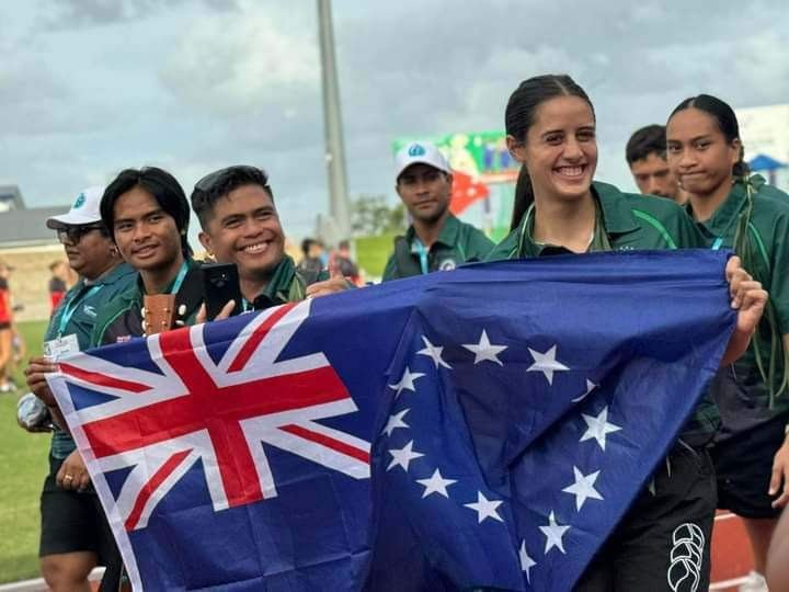 Cook Islands team with the flag at the opening ceremony
