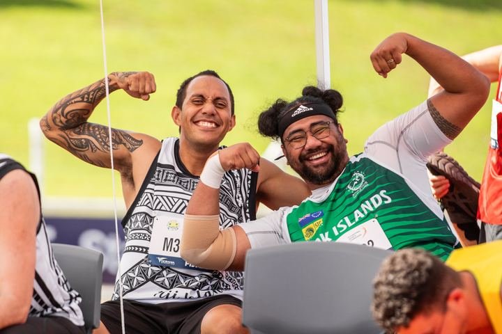 Flexing for the camera with a fellow competitor