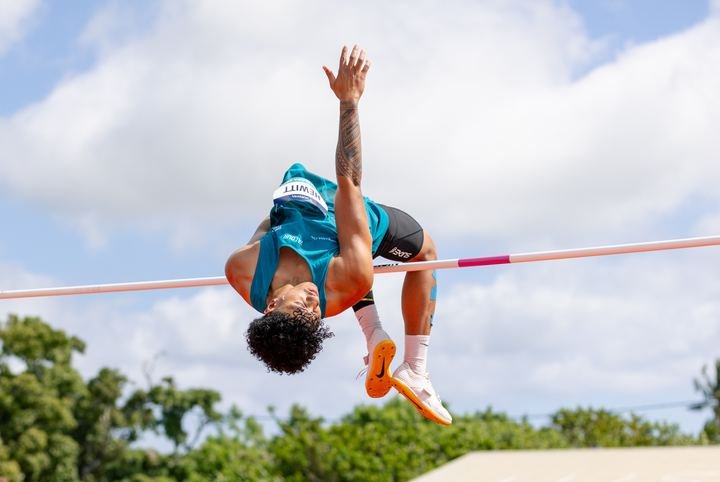 Arching over the high jump bar