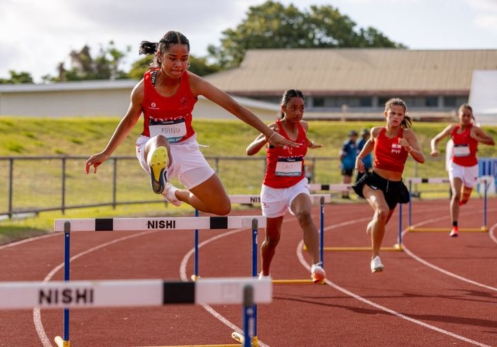 Hurdlers attack the barriers