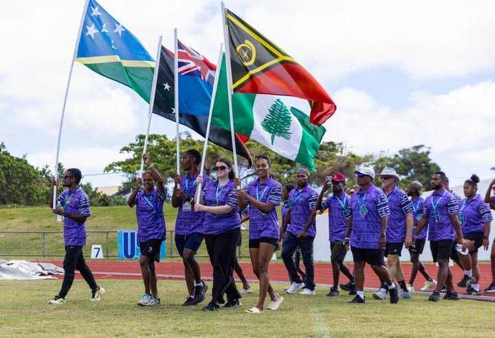 Flags lead the teams in at the opening