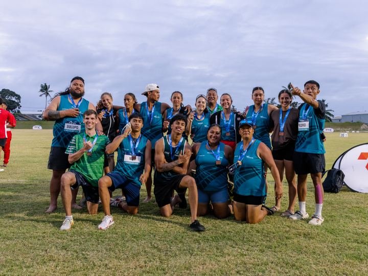 Team Polynesia together on the infield
