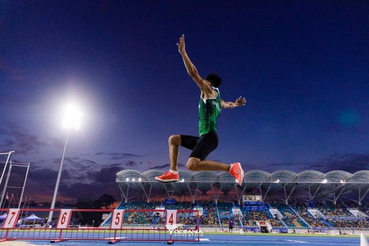 Long jump under the lights at the Pacific Games