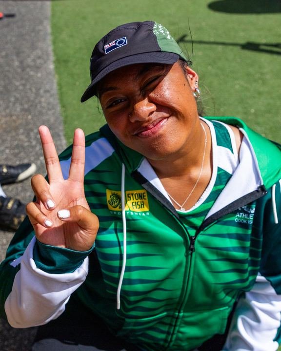 A peace sign from the Cook Islands team