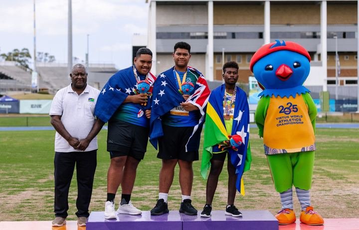 Cook Islands athletes with their medals on the podium