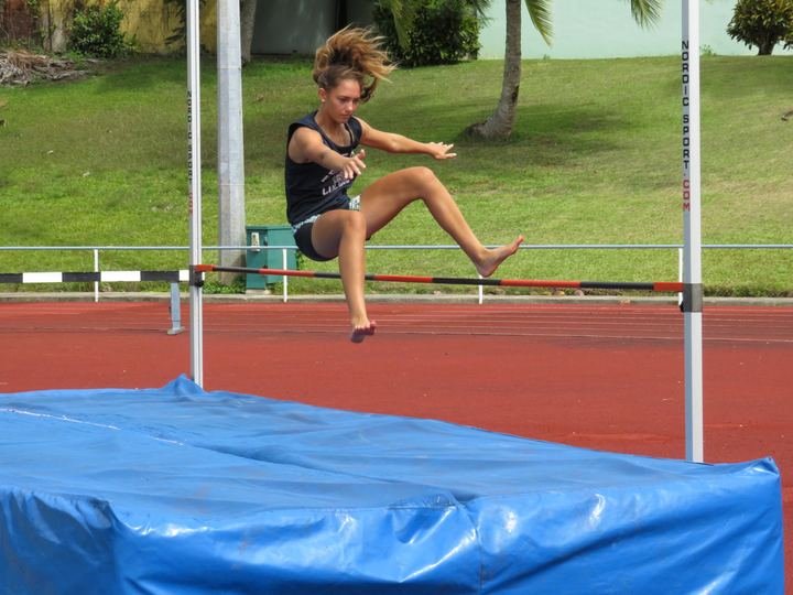 Clearing the bar in the high jump