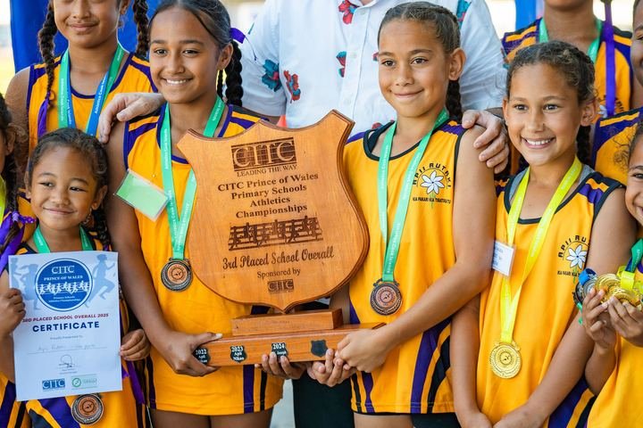 All smiles with the school shield and medals at prize-giving.