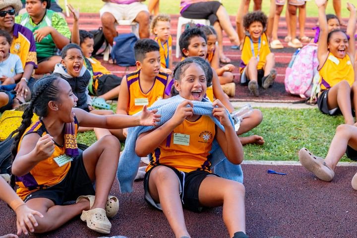 Pupils cheer on their team from the trackside