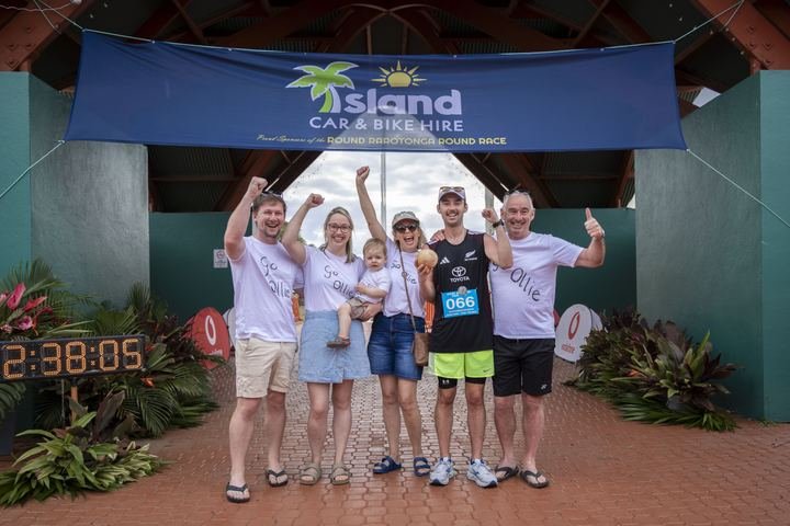 Supporters celebrate at the finish line